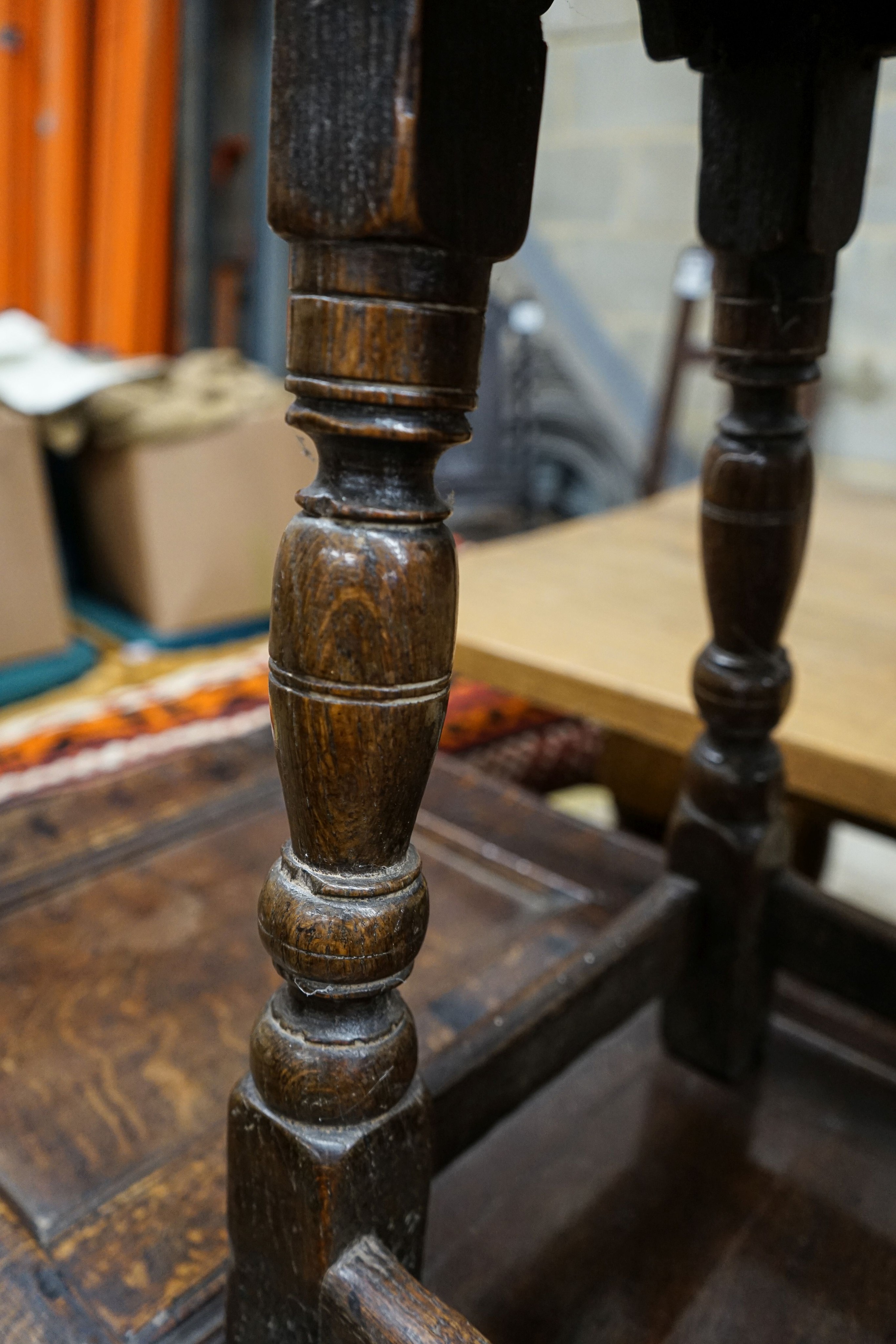 A 17th century style oak joint stool, with turned legs and carved apron, width 46cm, depth 27cm, height 56cm